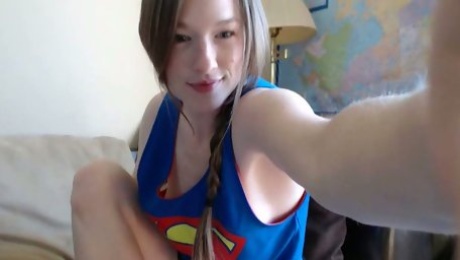 Sweet girl in Super man t-shirt Gemma Minx paints her toes