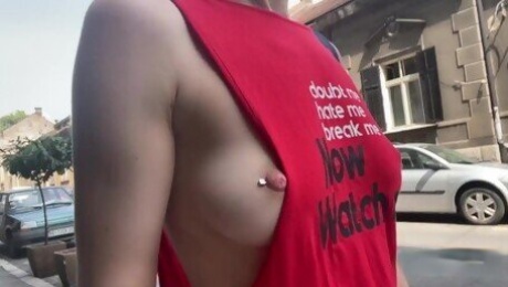 Braless walk in city. Flashing piercing nipples in public.