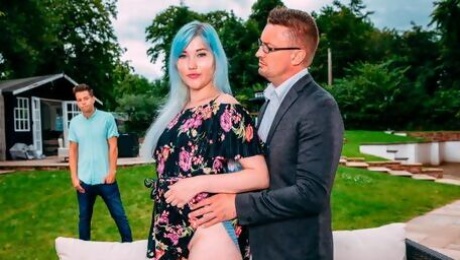 Blue-haired chick Misha Mayfair is serving two dicks in the garden